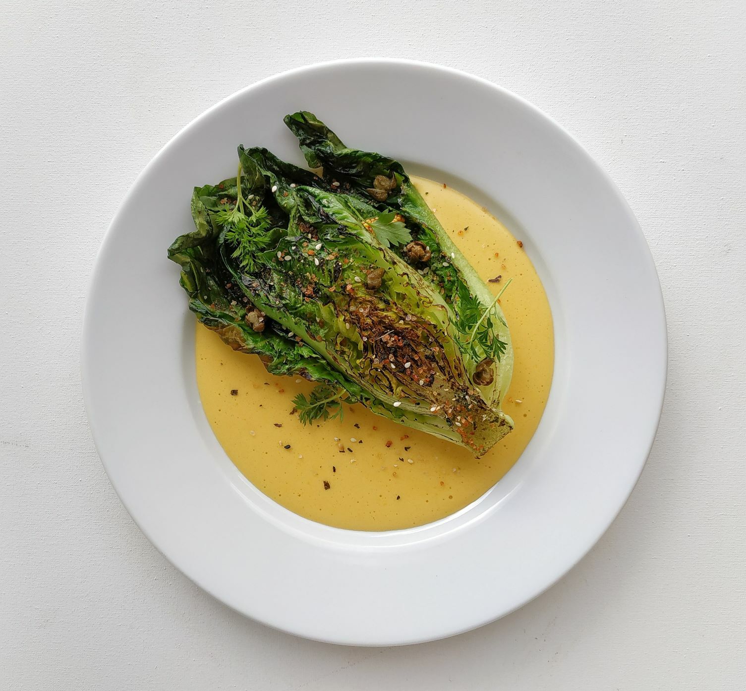 GRILLED ROMAINE LETTUCE WITH HOLLANDAISE SAUCE